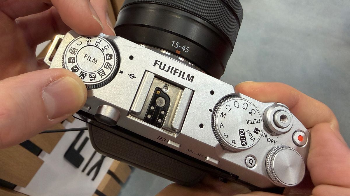 Mike Harris handling Fujifilm X-M5on trade-show floor
