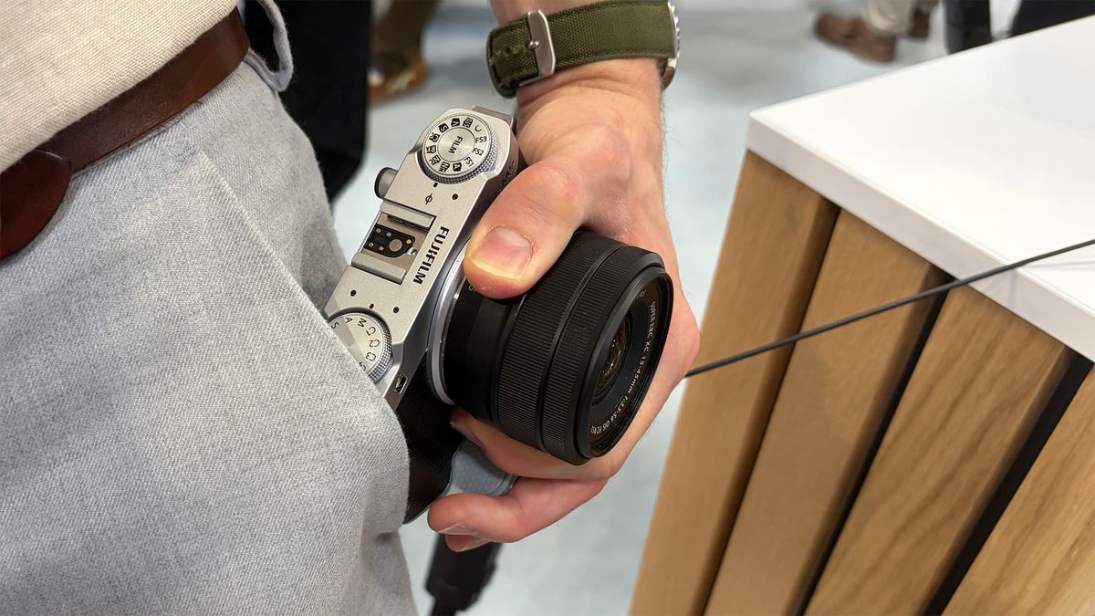 Mike Harris handling Fujifilm X-M5on trade-show floor